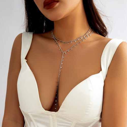 Set of two finer necklaces with decorative details, silver color.